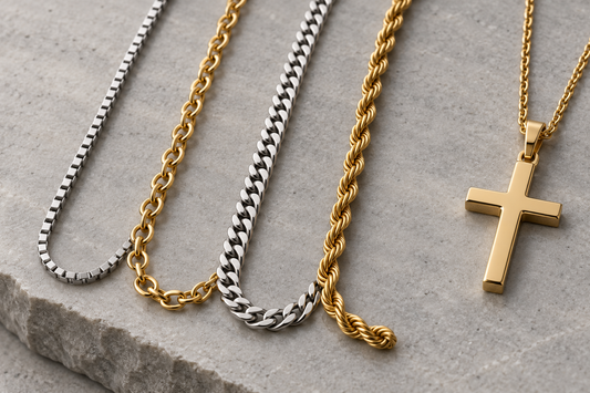 Box cable curb and rope chains displayed beside a gold cross pendant