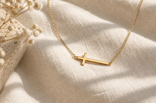Gold sideways cross necklace symbolizing faith and modern style