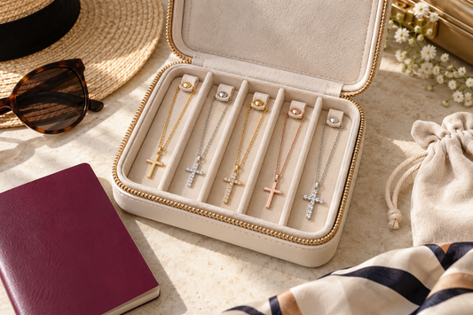 Cross necklaces stored separately in a cream travel jewelry case