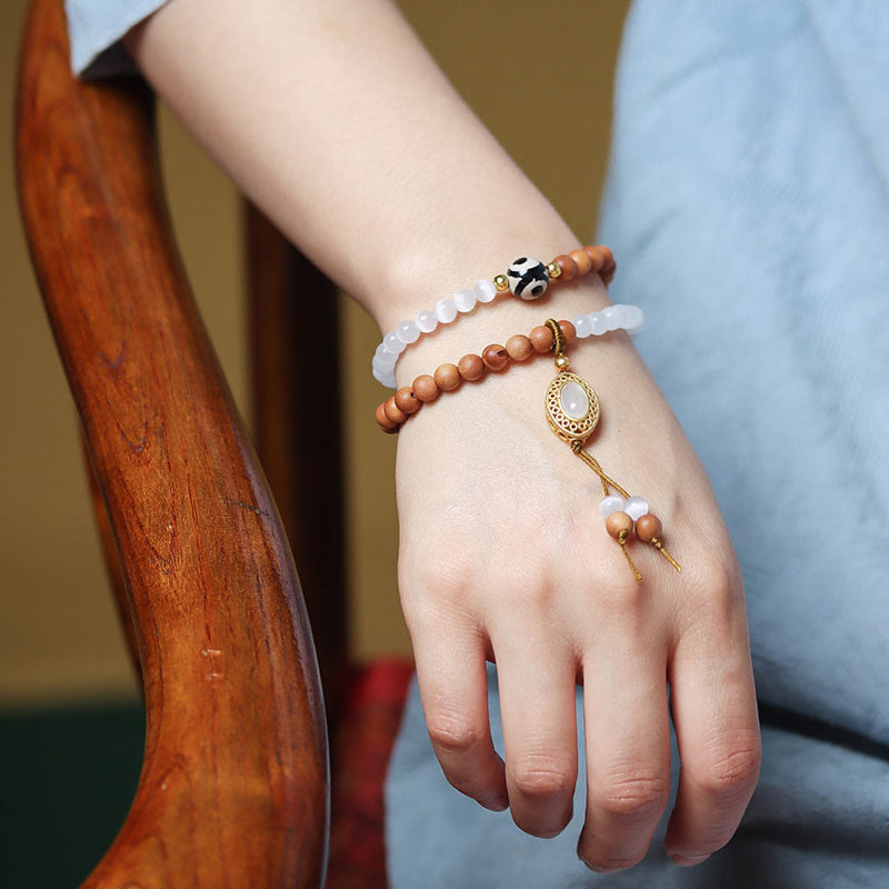 Bracelet en cristal de perles Dzi à trois yeux en œil de chat et bois de santal purifiant et guérisseur 