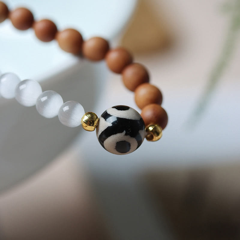 Bracelet en cristal de perles Dzi à trois yeux en œil de chat et bois de santal purifiant et guérisseur 
