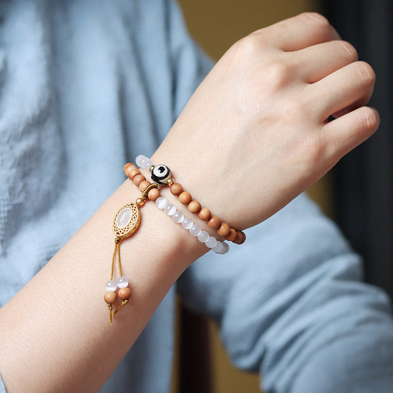 Bracelet en cristal de perles Dzi à trois yeux en œil de chat et bois de santal purifiant et guérisseur 