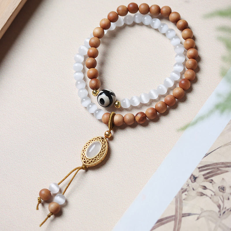 Bracelet en cristal de perles Dzi à trois yeux en œil de chat et bois de santal purifiant et guérisseur 