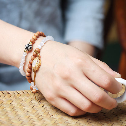 Bracelet en cristal de perles Dzi à trois yeux en œil de chat et bois de santal purifiant et guérisseur 