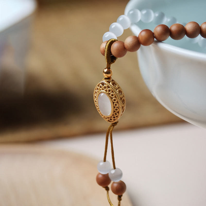 Bracelet en cristal de perles Dzi à trois yeux en œil de chat et bois de santal purifiant et guérisseur 