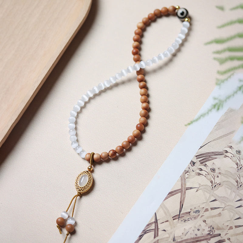 Bracelet en cristal de perles Dzi à trois yeux en œil de chat et bois de santal purifiant et guérisseur 