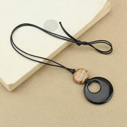 Collier pendentif en cuivre avec pierre d'obsidienne noire Liuli et image de Bouddha