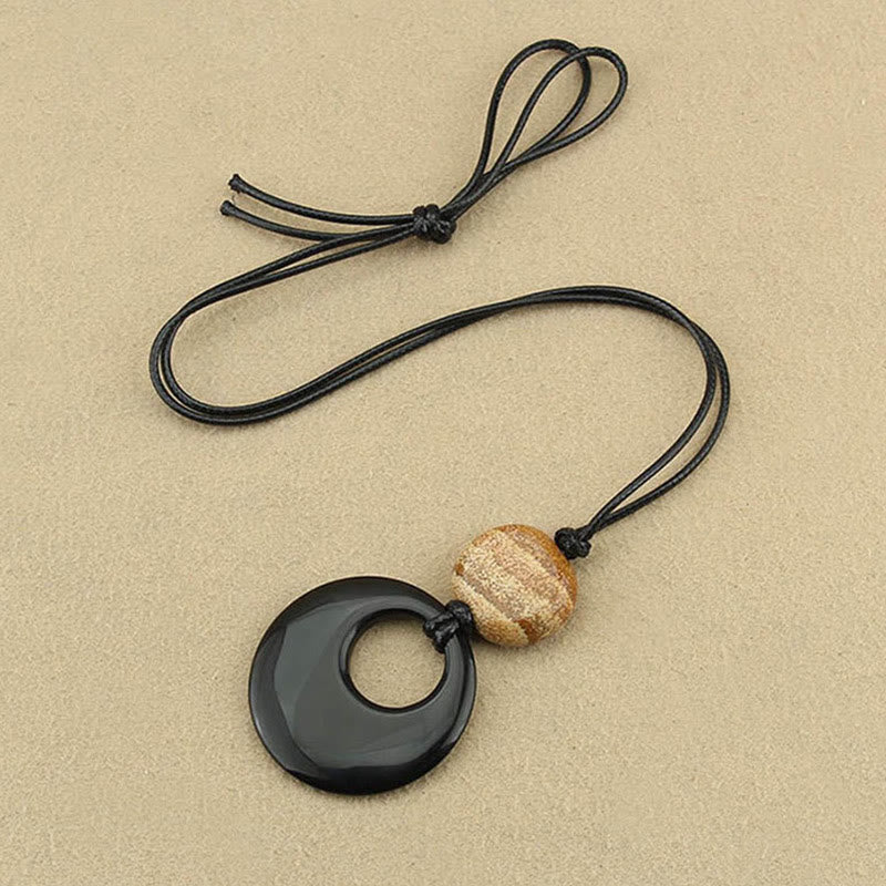 Collier pendentif en cuivre avec pierre d'obsidienne noire Liuli et image de Bouddha