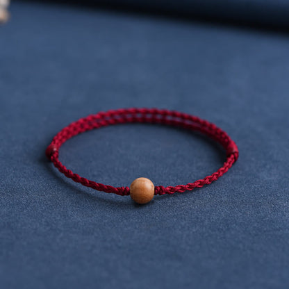 Bracelet tressé en perles de bois de pêche naturel Buddha Stones pour éloigner les mauvais esprits