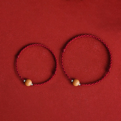 Bracelet de cheville tressé en perles de bois de pêcher naturel avec pierres de Bouddha