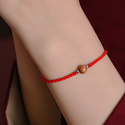 Bracelet de cheville tressé en perles de bois de pêcher naturel avec pierres de Bouddha
