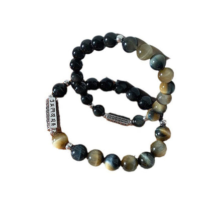 Bracelet en obsidienne noire naturelle et œil de tigre avec six mots authentiques « om mani padme hum » et force et amour 