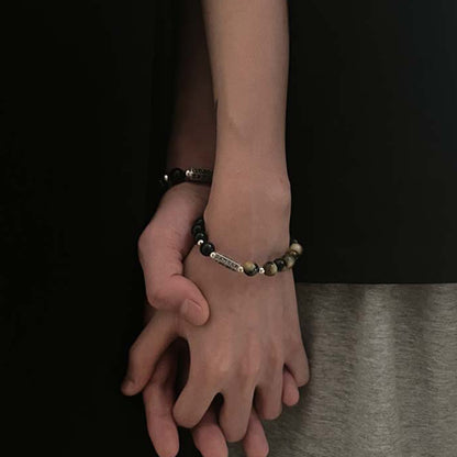 Bracelet en obsidienne noire naturelle et œil de tigre avec six mots authentiques « om mani padme hum » et force et amour 