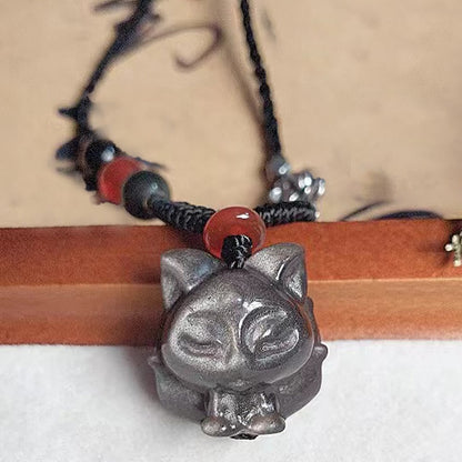 Collier pendentif de protection en obsidienne naturelle argentée et brillante représentant un renard à neuf queues