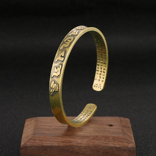 Bracelet manchette en cuivre avec six mots authentiques « om mani padme hum » et « sūtra du cœur », symbole de la sagesse et de la paix