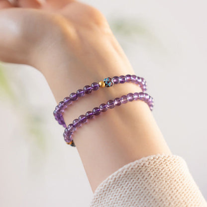 Bracelet de conscience spirituelle en améthyste naturelle et lotus en pierres de Bouddha