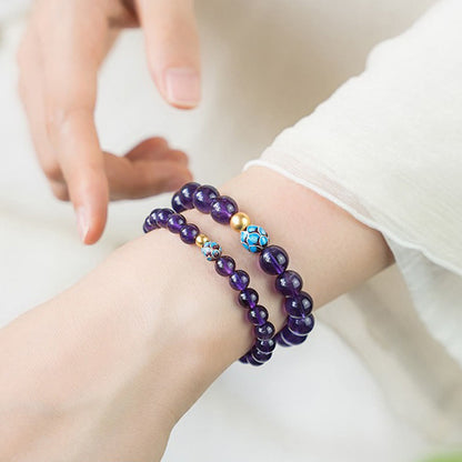 Bracelet de conscience spirituelle en améthyste naturelle et lotus en pierres de Bouddha
