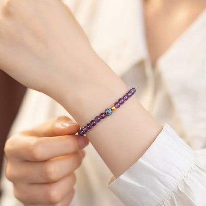 Bracelet de conscience spirituelle en améthyste naturelle et lotus en pierres de Bouddha