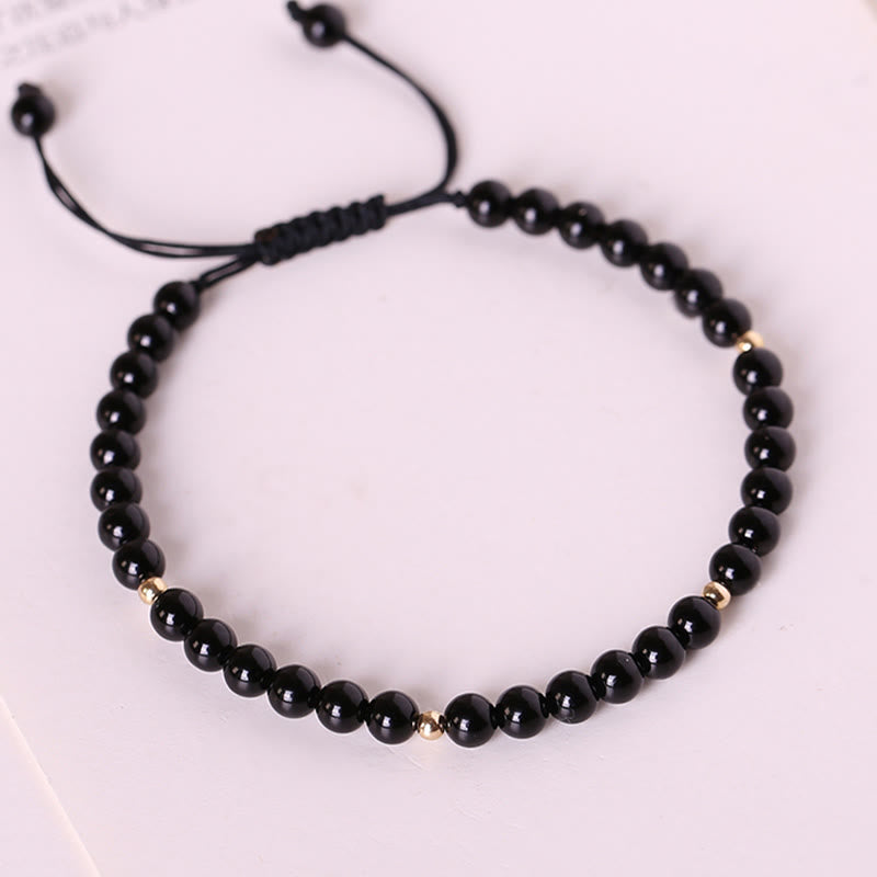 Bracelet en corde d'accomplissement avec petites perles d'obsidienne noire et pierres de Bouddha
