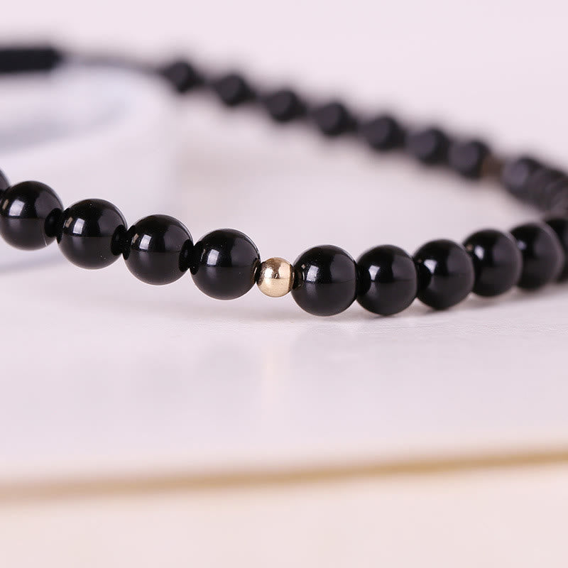 Bracelet en corde d'accomplissement avec petites perles d'obsidienne noire et pierres de Bouddha