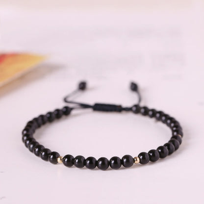Bracelet en corde d'accomplissement avec petites perles d'obsidienne noire et pierres de Bouddha