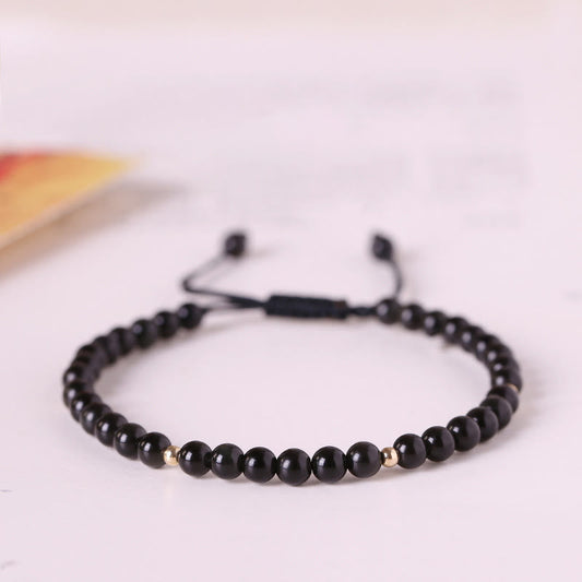 Bracelet en corde d'accomplissement avec petites perles d'obsidienne noire et pierres de Bouddha