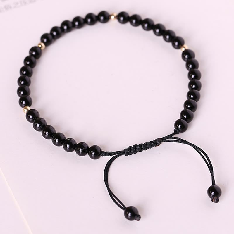 Bracelet en corde d'accomplissement avec petites perles d'obsidienne noire et pierres de Bouddha