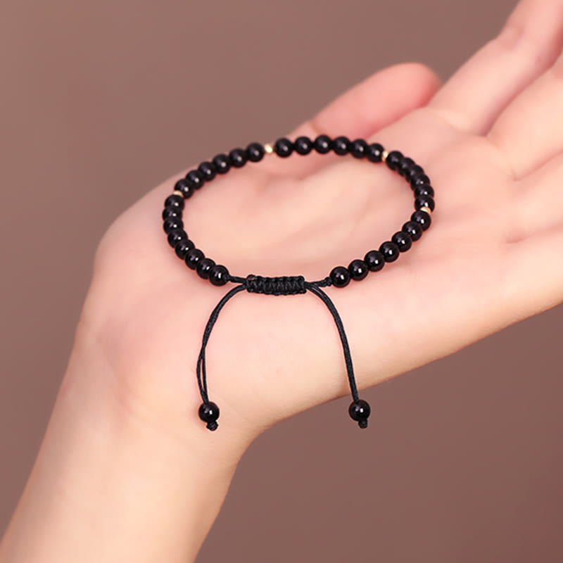 Bracelet en corde d'accomplissement avec petites perles d'obsidienne noire et pierres de Bouddha