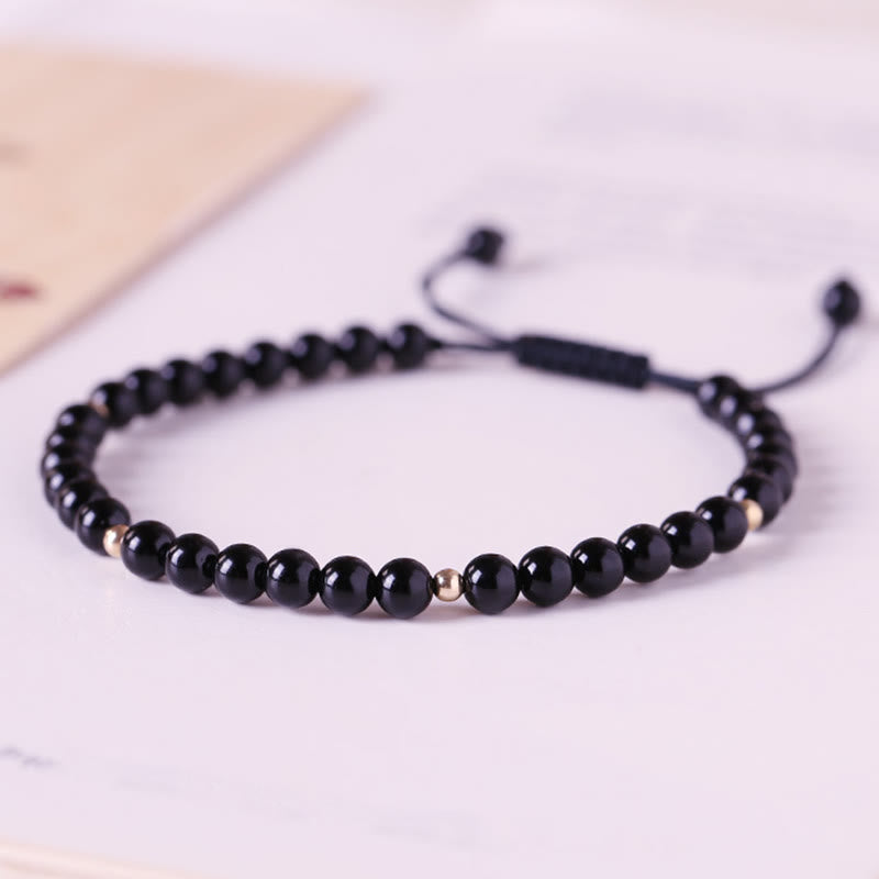 Bracelet en corde d'accomplissement avec petites perles d'obsidienne noire et pierres de Bouddha