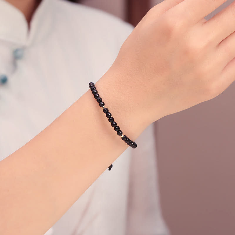 Bracelet en corde d'accomplissement avec petites perles d'obsidienne noire et pierres de Bouddha