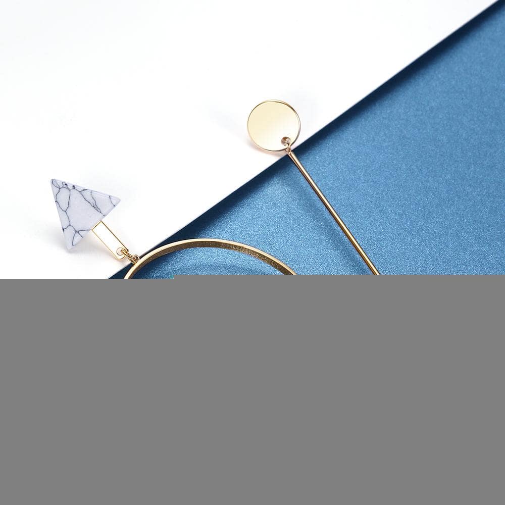 Boucles d'oreilles pendantes asymétriques en or clair Viennois