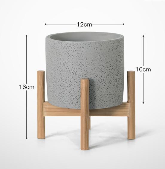 Pots de fleurs minimalistes en céramique et fer forgé simples