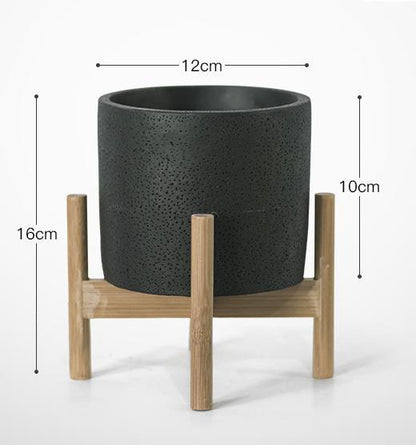 Pots de fleurs minimalistes en céramique et fer forgé simples